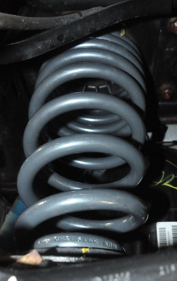 A CargoMaxxHD coil spring installed in a truck